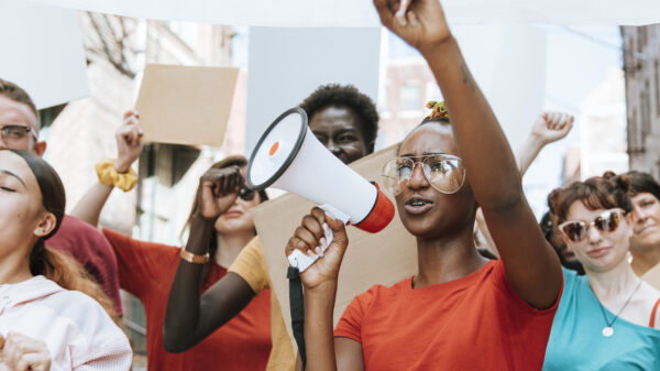 A group of protesters with blank signs
