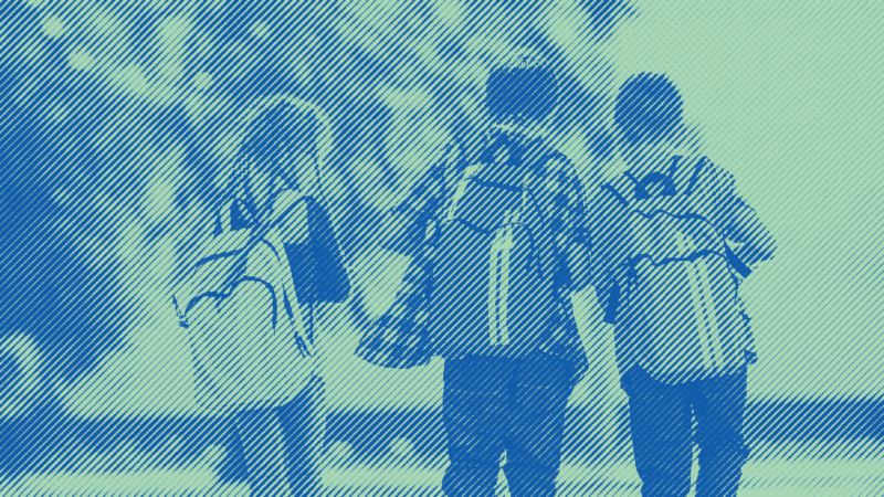 3 Children with backpacks walking home from school