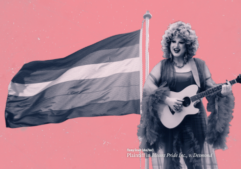 Flamy Grant, a drag queen, is against a pink background with a pride flag waving next to her