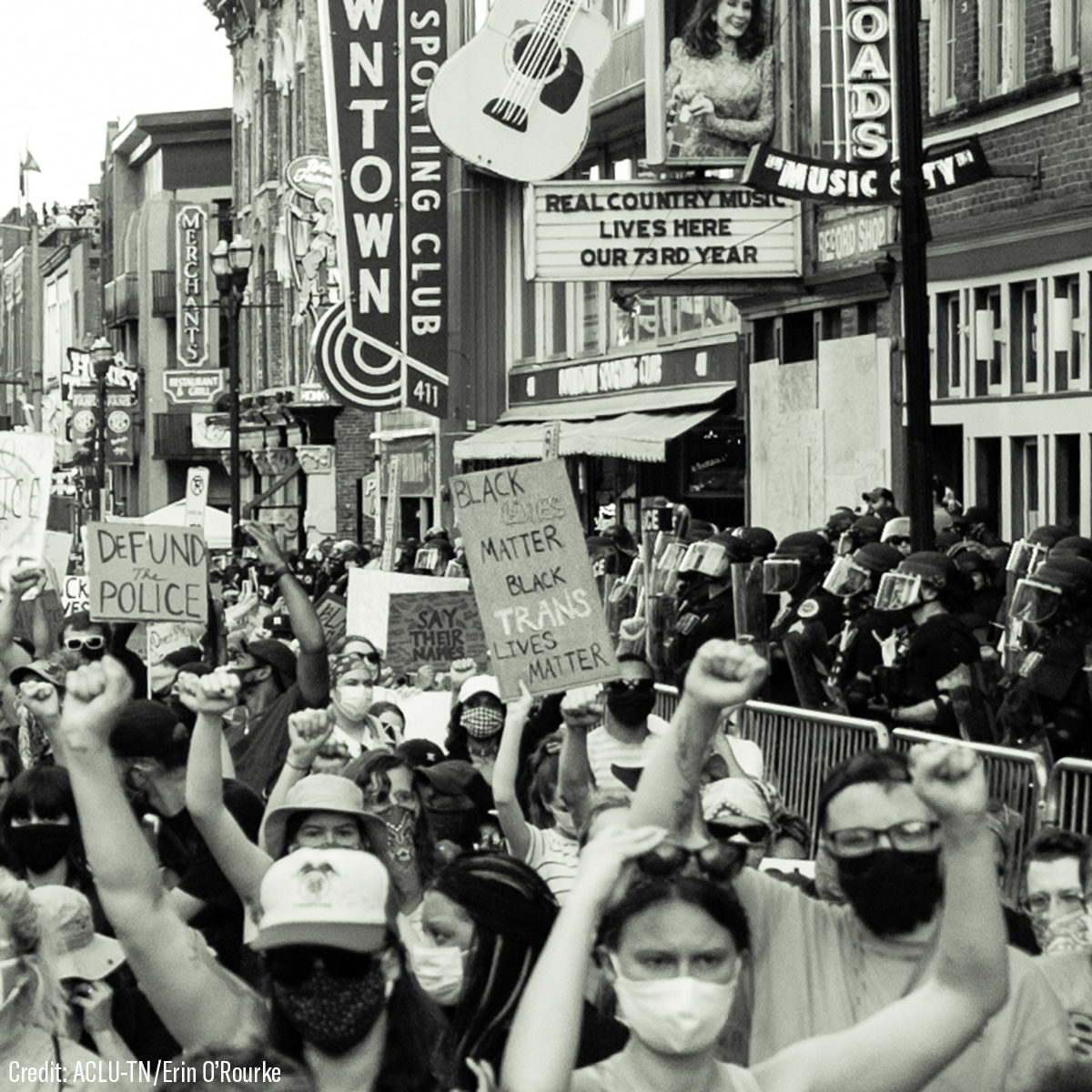 B&W photo of people protesting for Trans rights