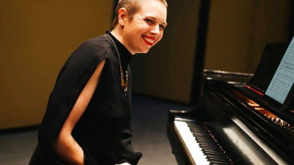 Maeve Brophy sits at a piano.