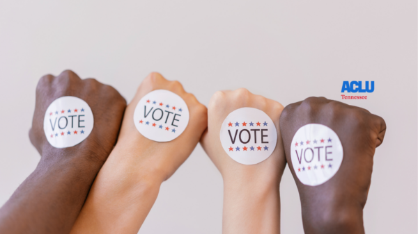 Four different fists with "Vote" stickers on them.