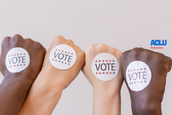 Four different fists with "Vote" stickers on them.