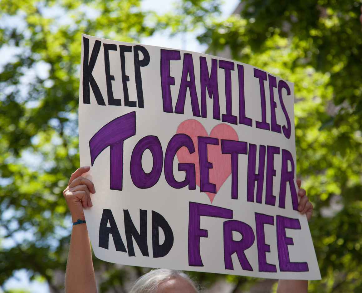 protest sign with "Keep Families Together" written on it