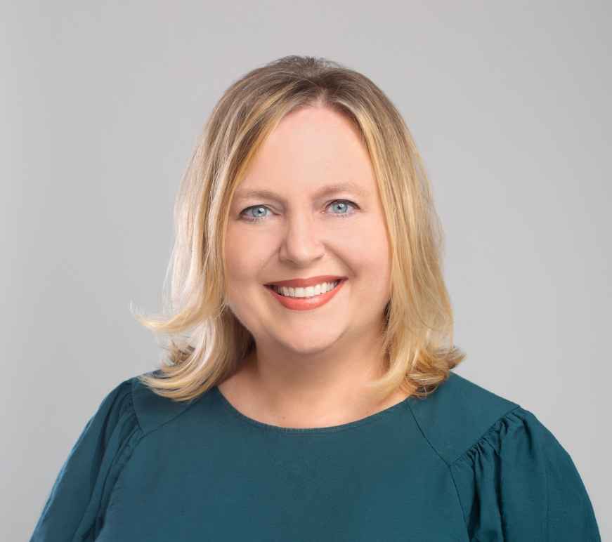 New executive director smiles in professional photo